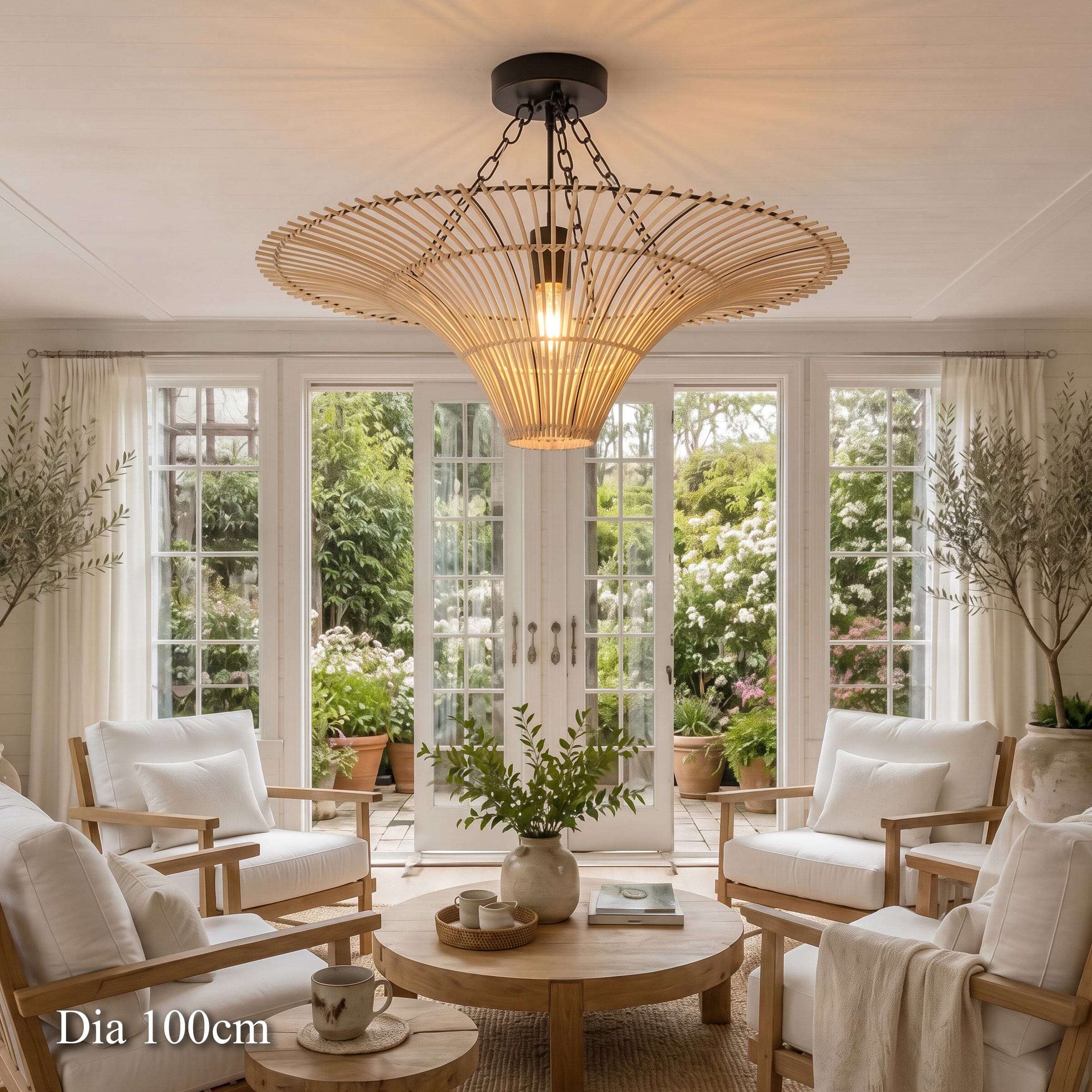 100cm rattan saucer ceiling light above a sunlit lounge with armchairs