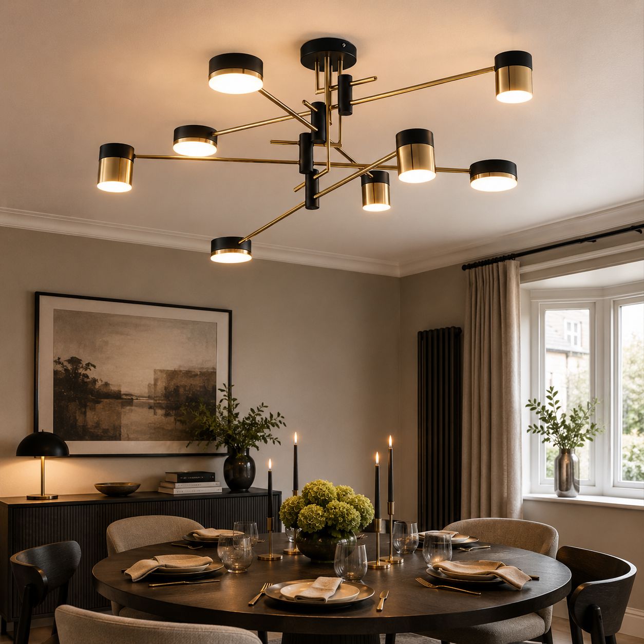 black and gold ceiling light over a dining table