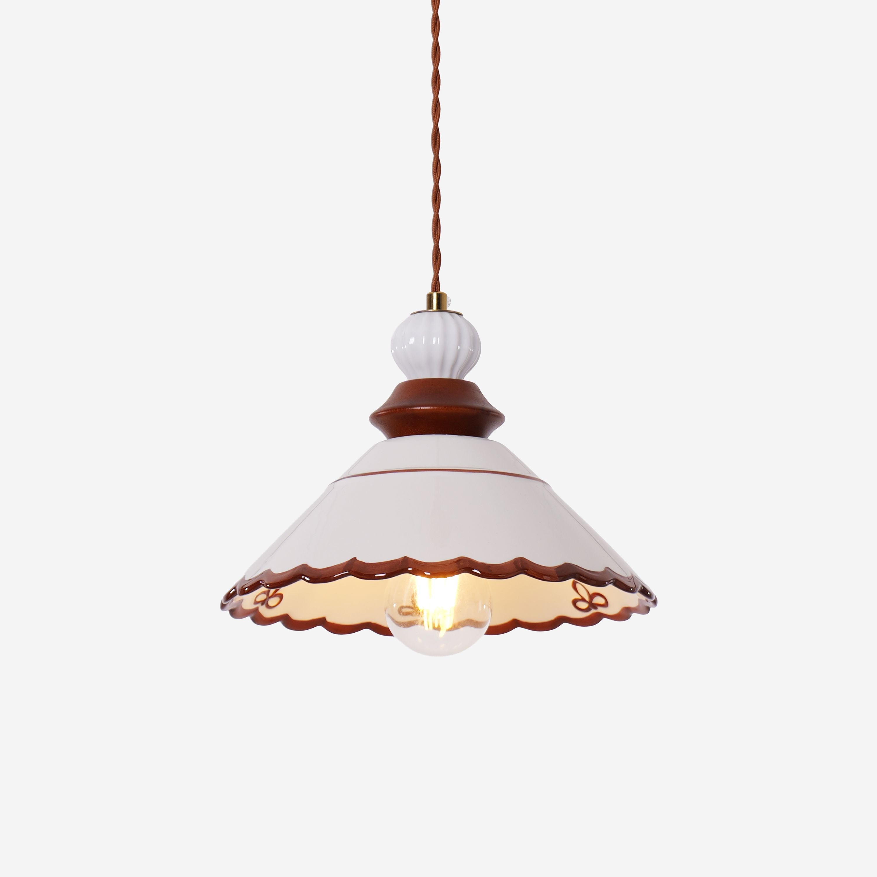 brown ceramic lace pendant light over a kitchen island
