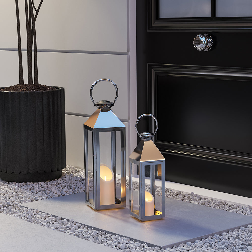 Candle Lantern features a high-polish silver finish, sleek design and oversized loop on top.