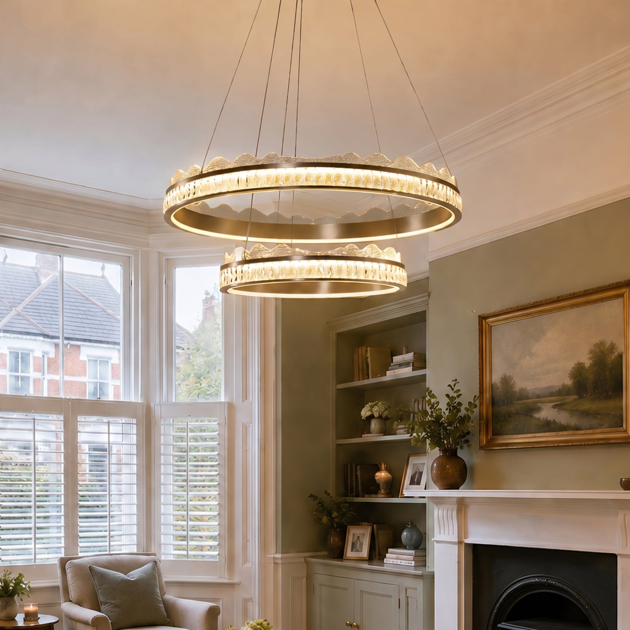 golden crystal dual-ring LED pendant light above a bright living room corner
