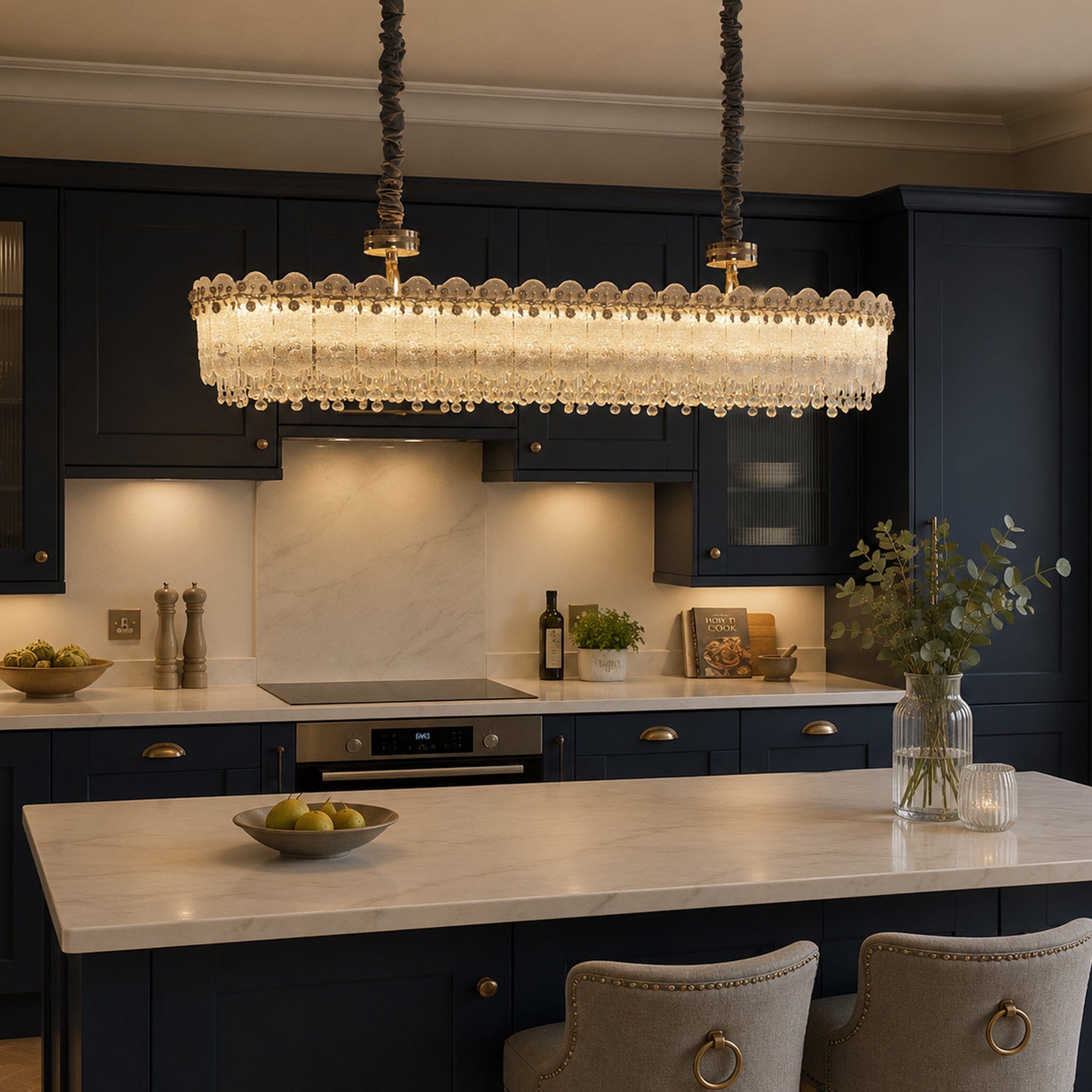 contemporary crystal oval pendant light linear chandelier in a dark kitchen setting