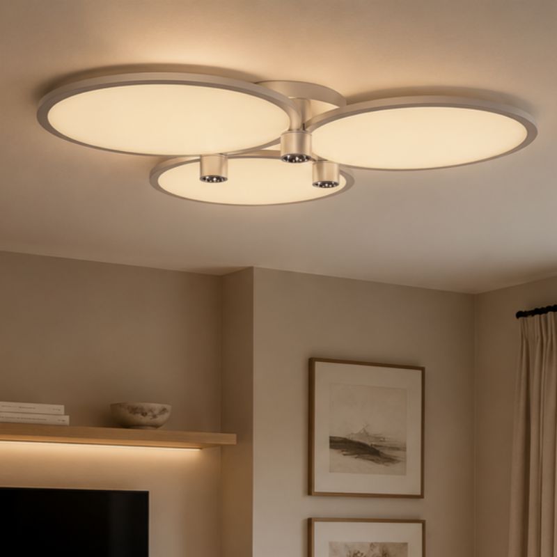 silver three-disk LED ceiling light in a living room