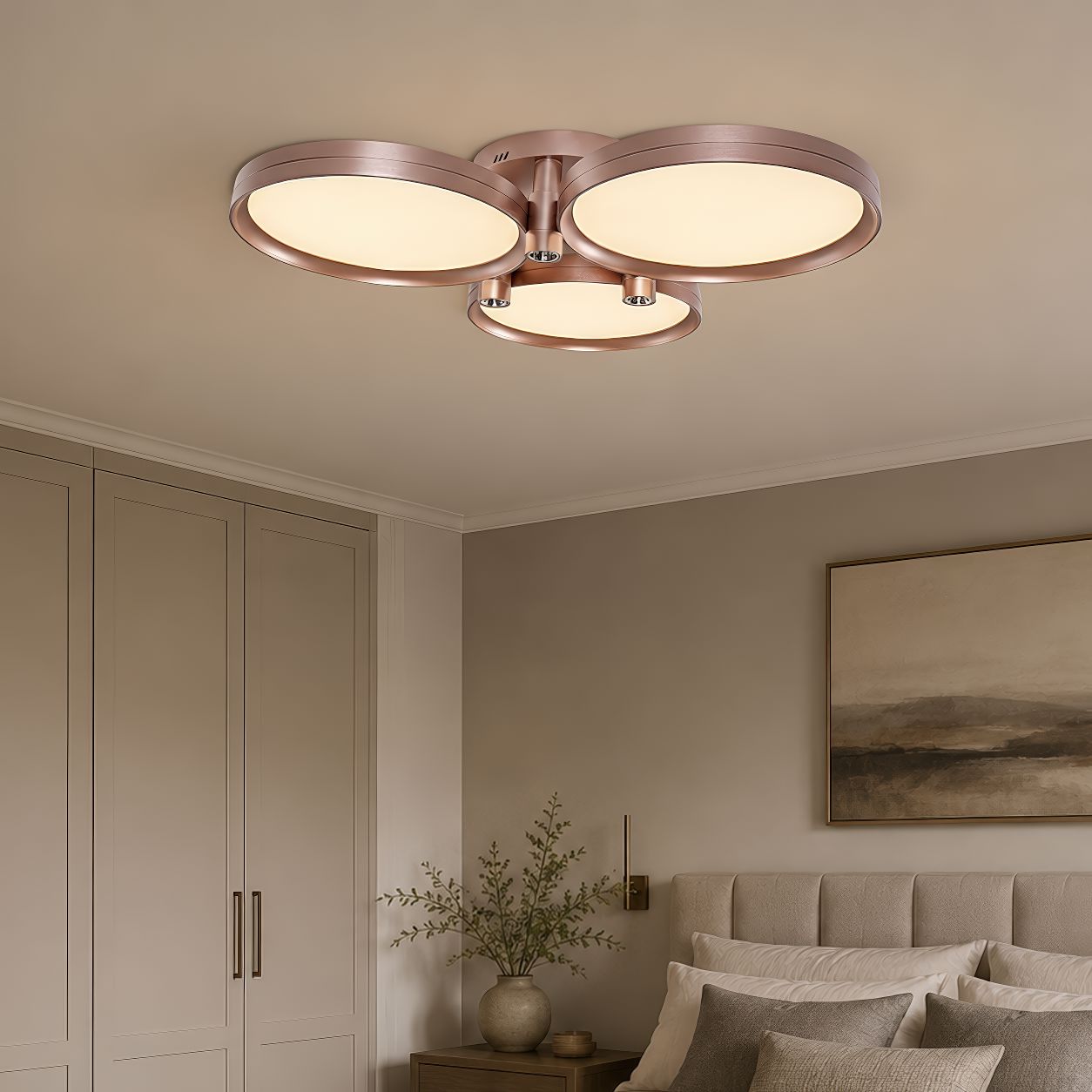 champagne gold three-disk ceiling light above a bedroom