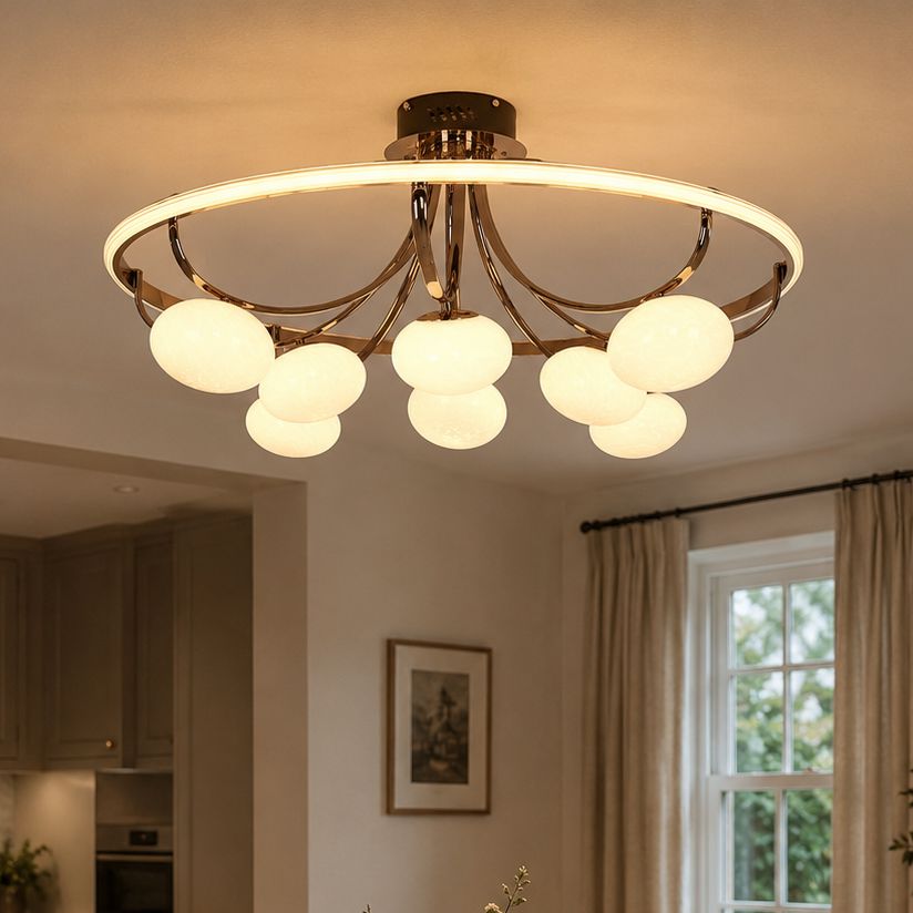 gold ring ceiling light with marble glass globes in a dining room