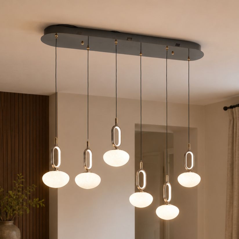 cloud glass pendant light with metal frame above a dining table