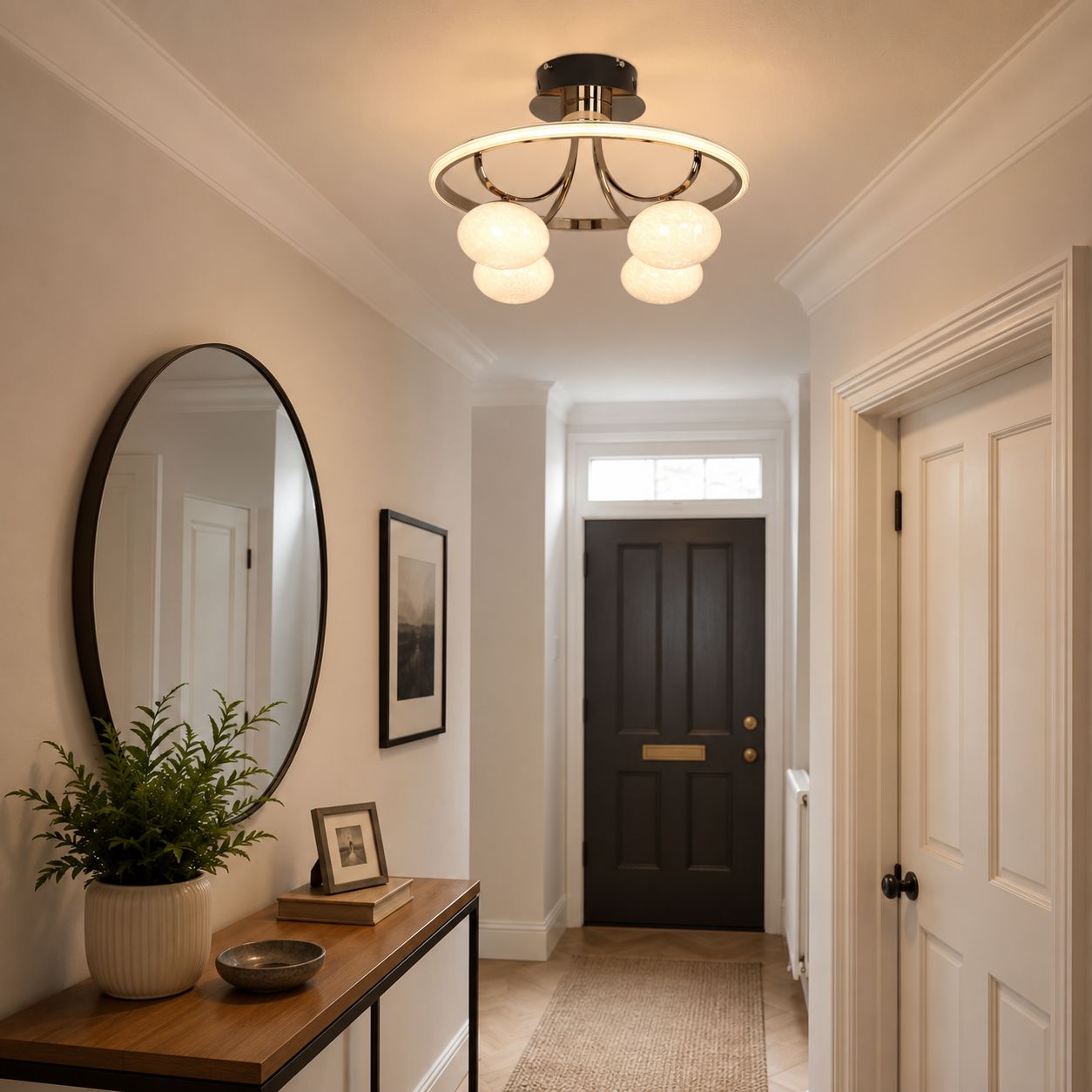 gold circular ceiling light in a hallway by the front door