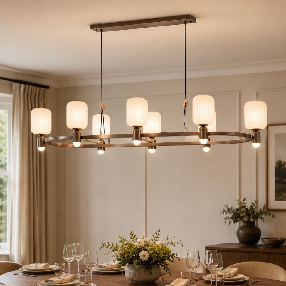 C-shaped bronze chandelier above a dining table