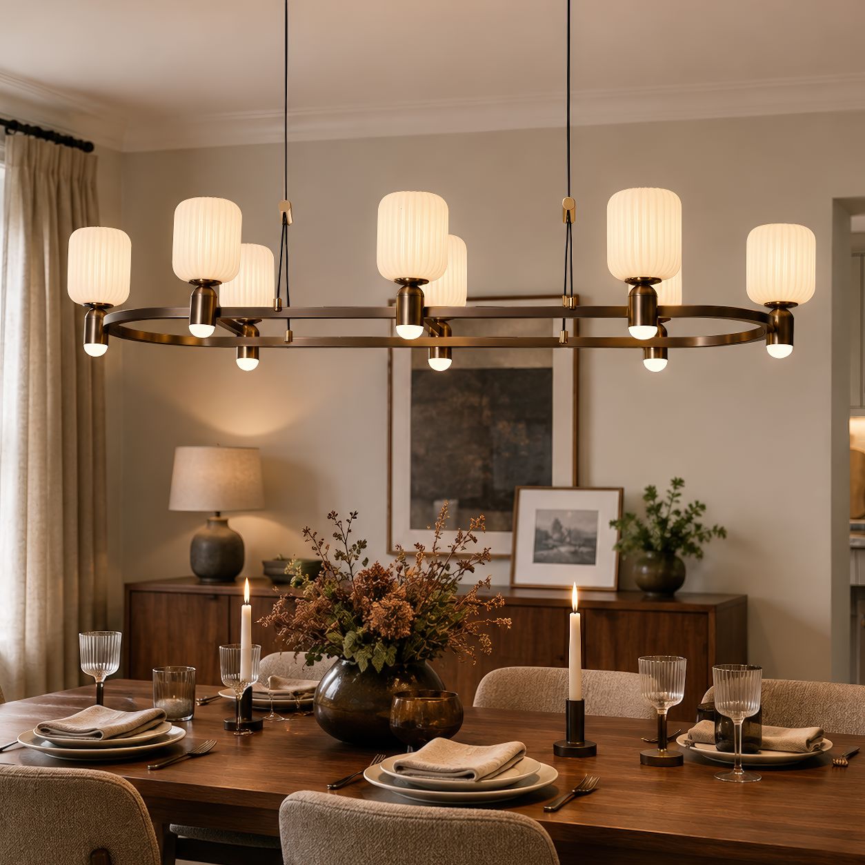 bronze C-shaped chandelier above a dining table
