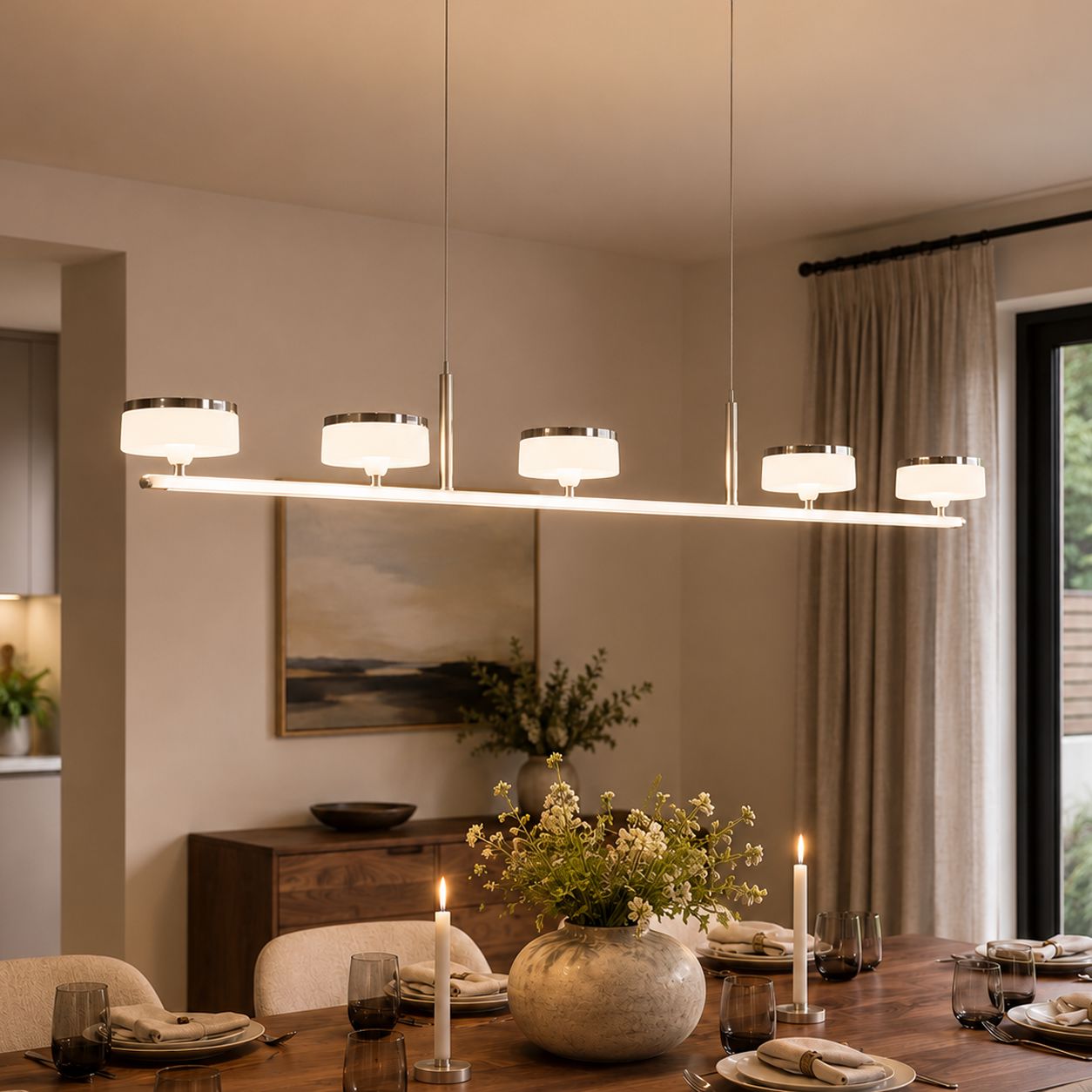 linear acrylic chandelier above a dining table in a modern room