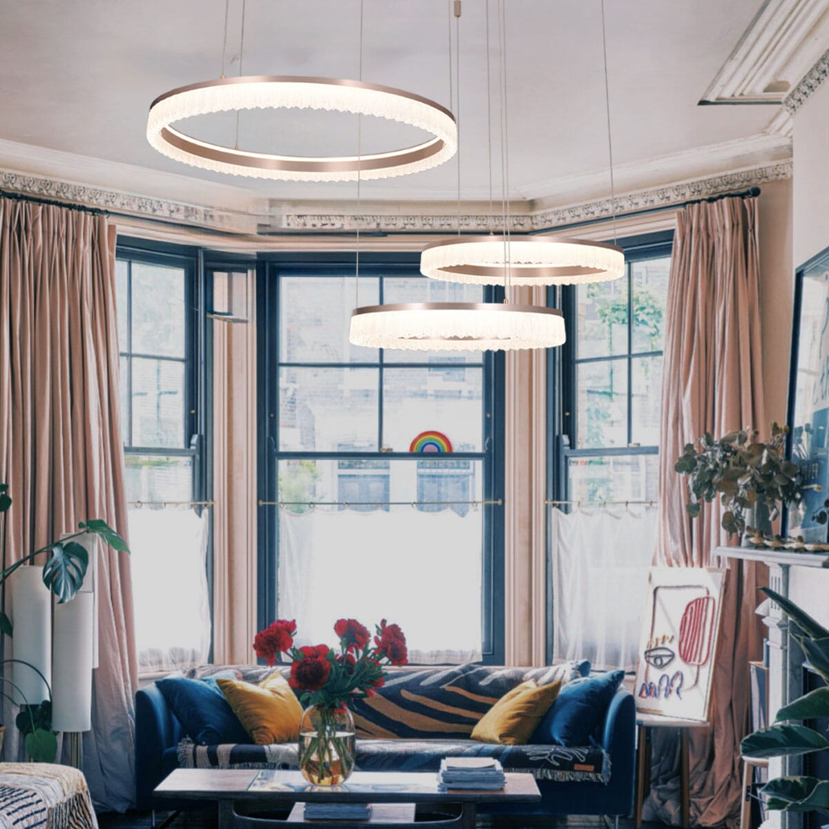 red aluminum circular pendant light above a colourful modern living room