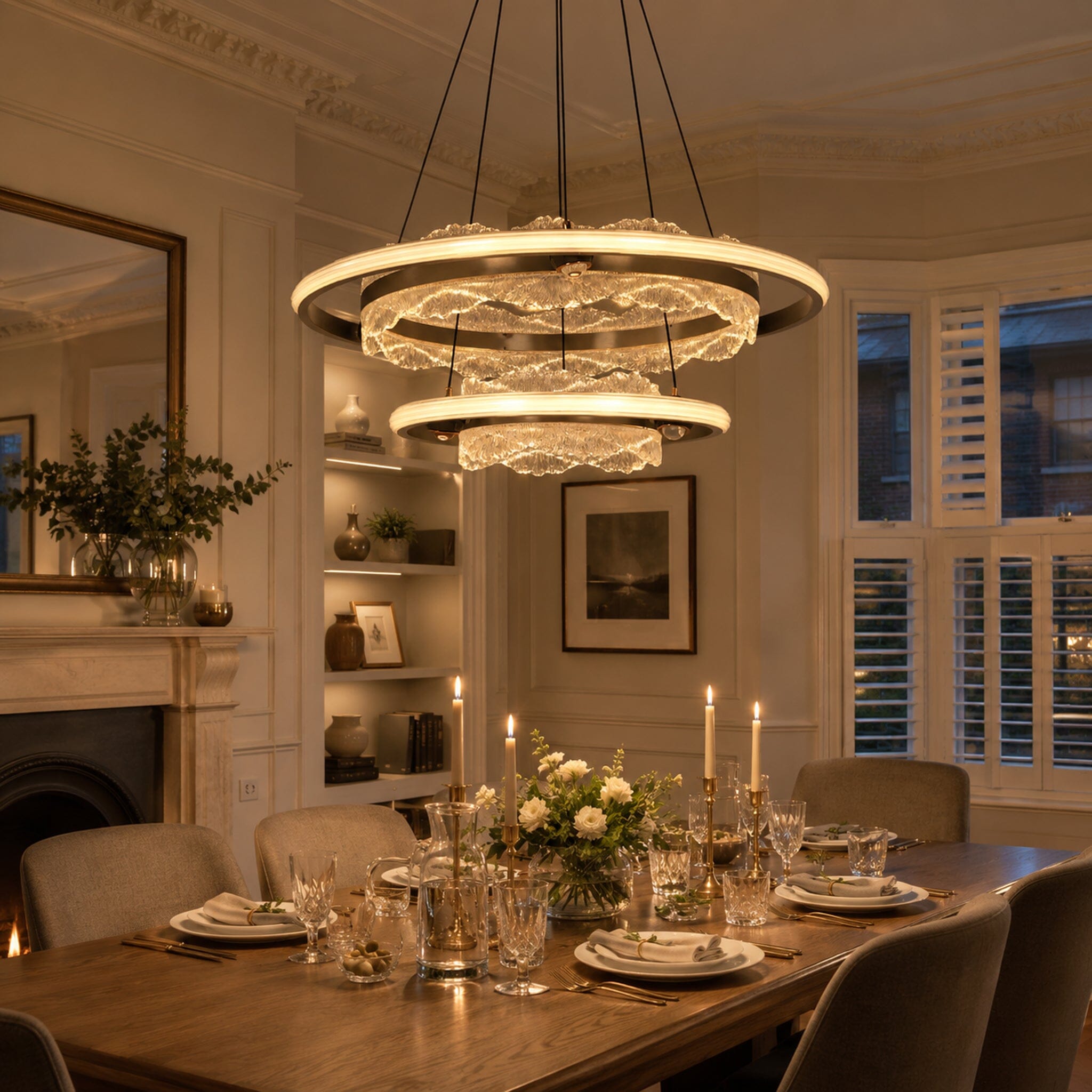 round acrylic pendant light above a dining table with flowers