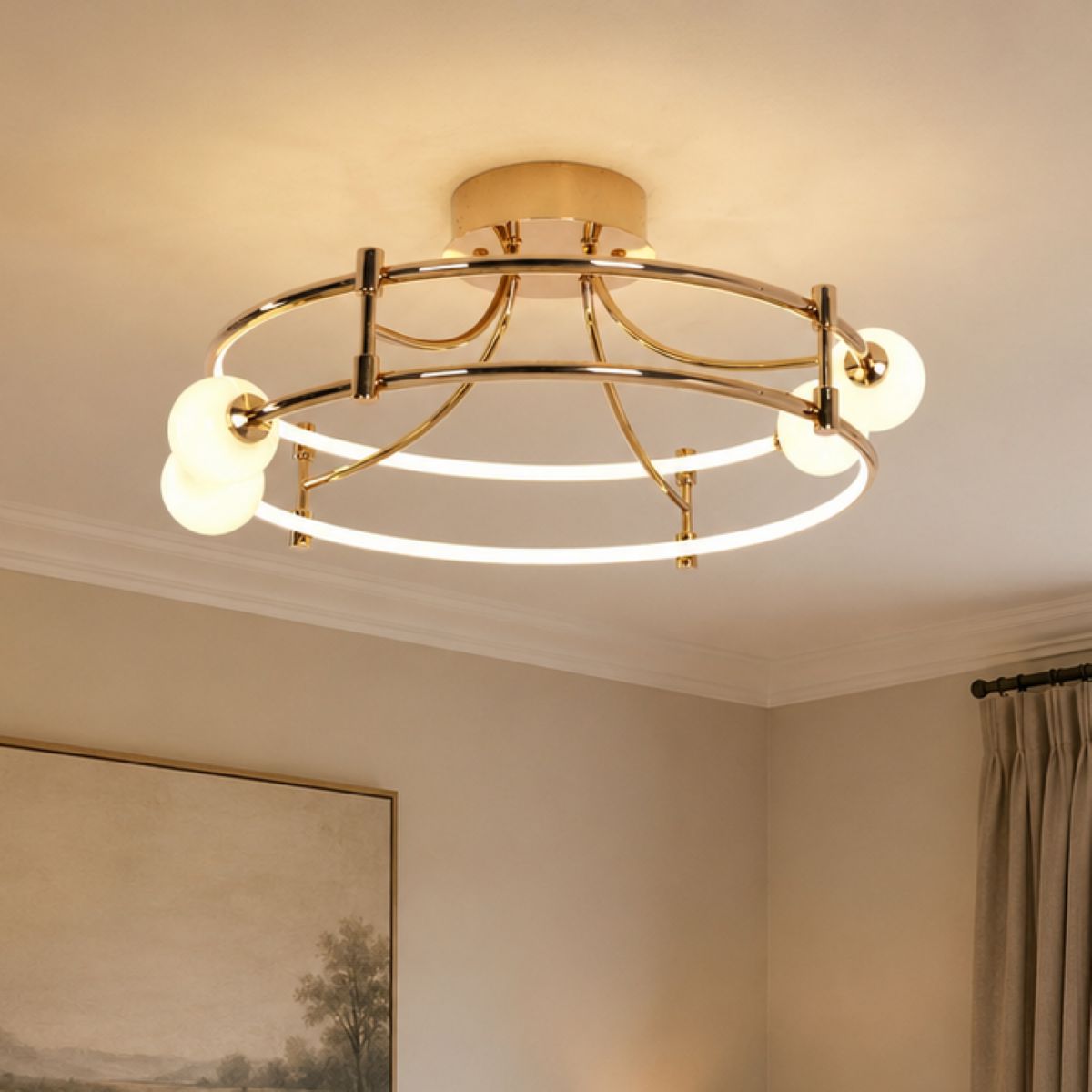 gold LED ceiling light with glass globes in a bedroom