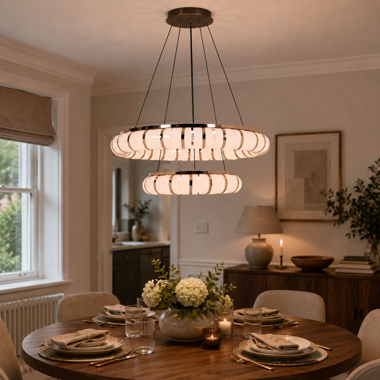 dual-ring modern LED pendant above a wooden dining table