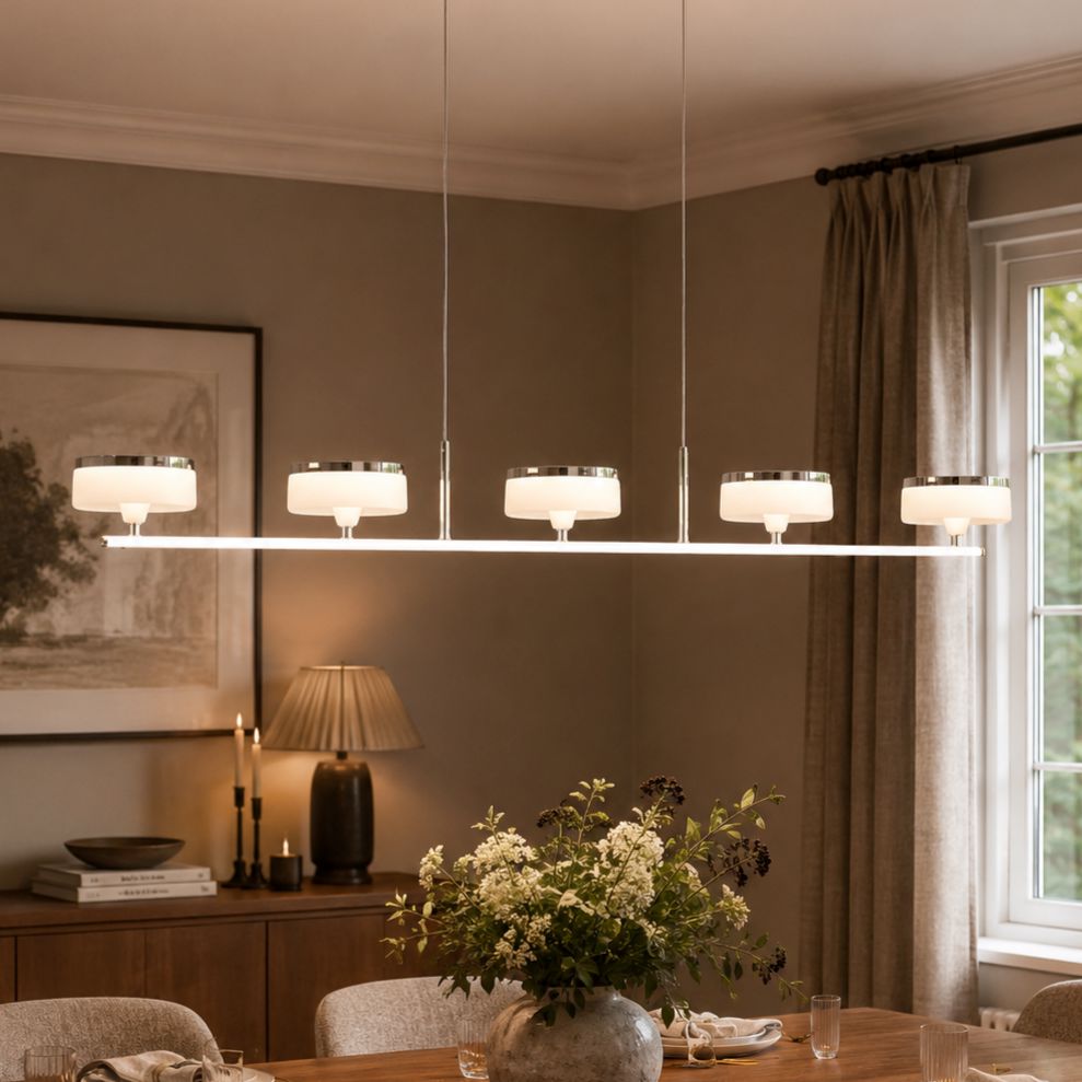 linear aluminum acrylic chandelier above a dining table
